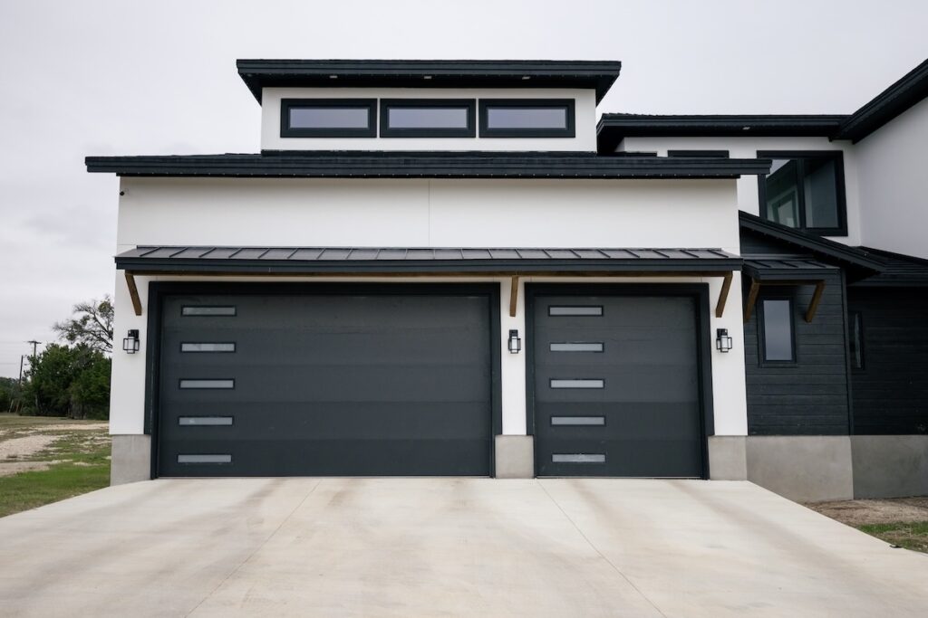 Modern professional garage door repair technician working on a residential garage door in Killeen, TX